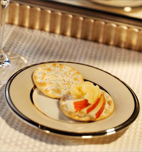 Pear and Cheddar Topped Carr's® Table Water® Crackers with Cracked Pepper