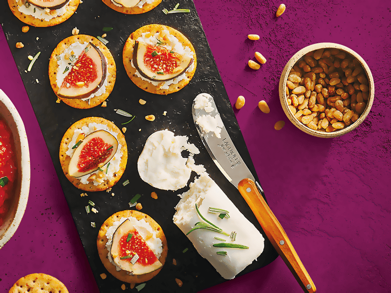 Toasteds® Crackers topped with Goat Cheese, Fig & Pine Nuts