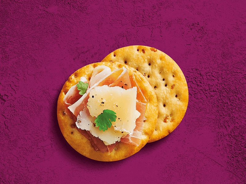 Toasteds® Crackers topped with Manchego & Serrano Ham