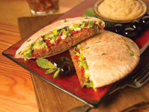 Mediterranean Vegan Pita Burger Served with Spicy Lime Sauce